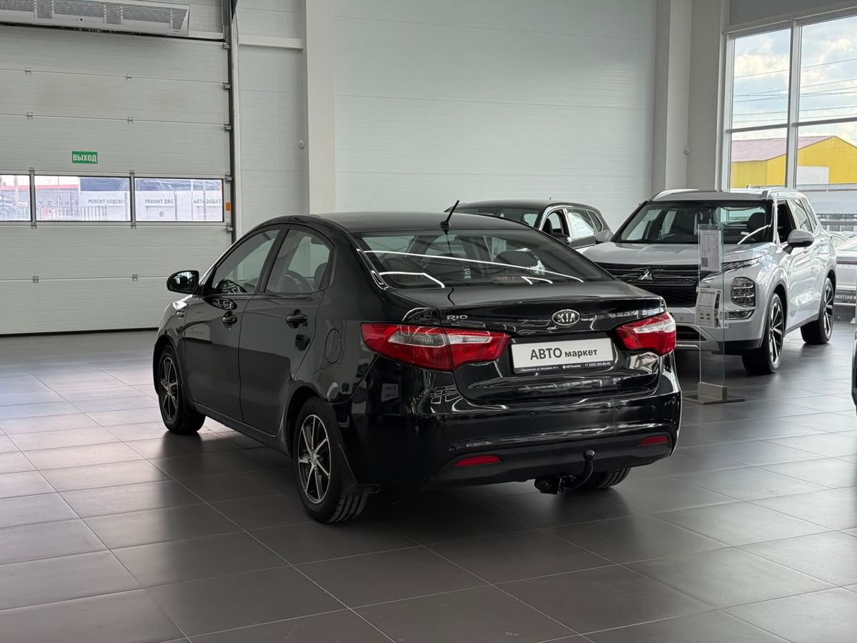 Kia Rio III 5-speed 1.6 MT (123 л.с.) 2012 — фото 2