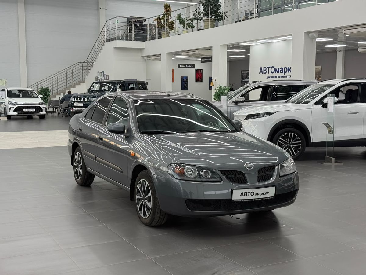 Nissan Almera II (N16) Рестайлинг 1.5 MT (98 л.с.) 2003