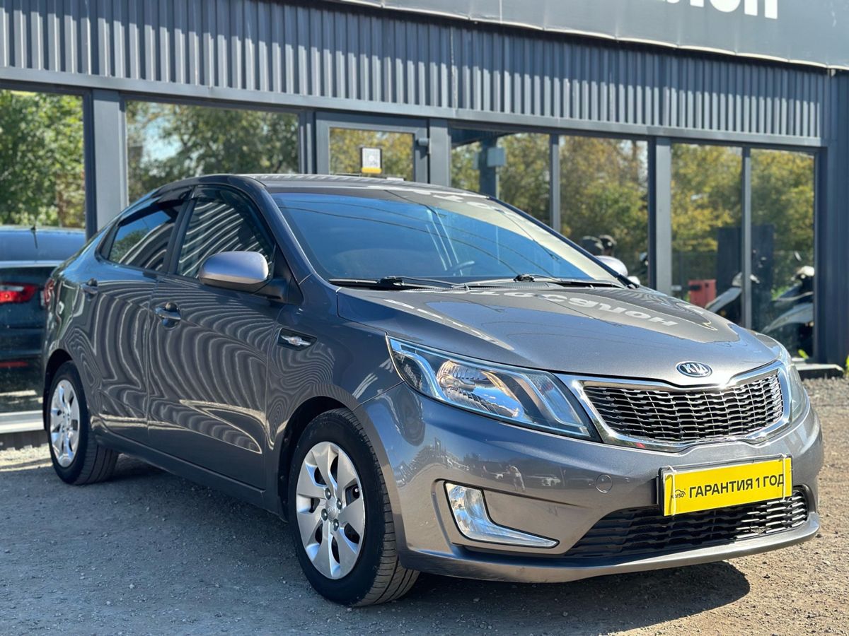 Kia Rio III 6-speed 1.6 AT (123 л.с.) Luxe 2014 — купить в Самаре