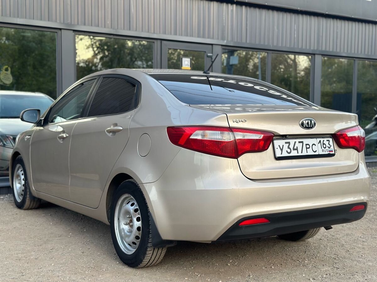 Kia Rio III 1.4 AT (107 л.с.) Comfort 2014 — фото 10