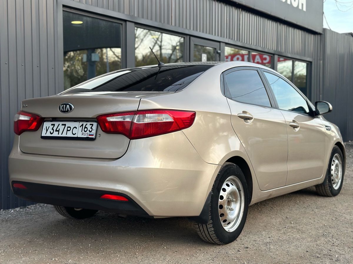 Kia Rio III 1.4 AT (107 л.с.) Comfort 2014 — фото 7