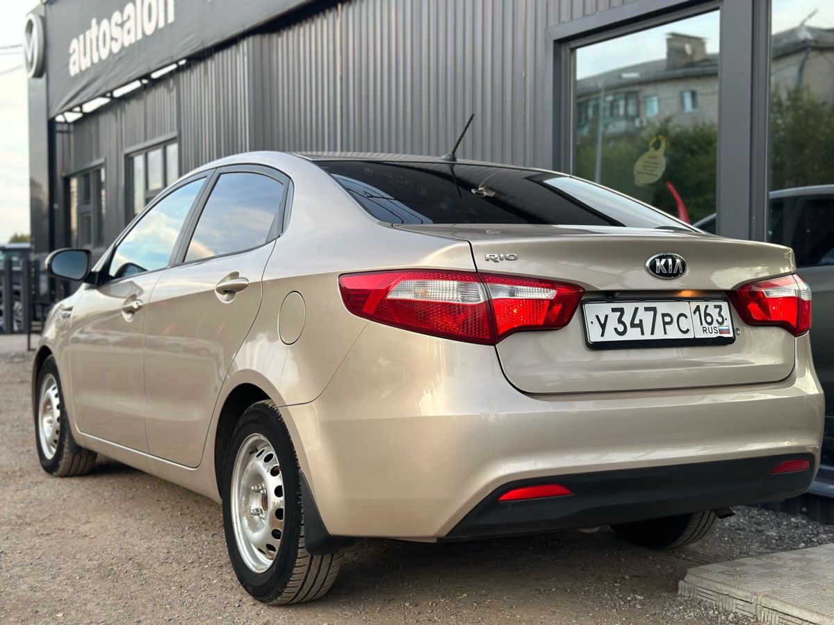 Kia Rio III 1.4 AT (107 л.с.) Comfort 2014 — фото 8