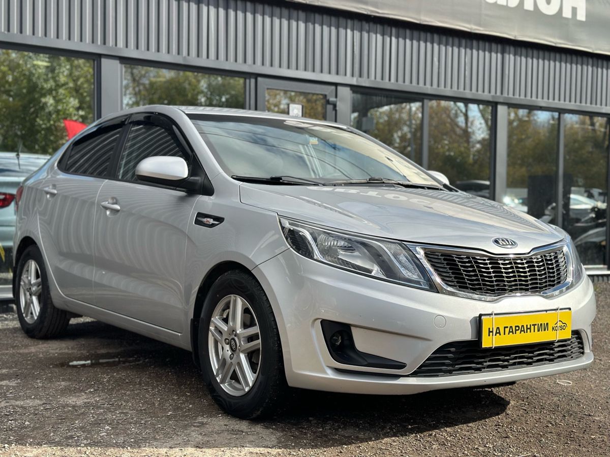 Kia Rio III 6-speed 1.6 MT (123 л.с.) Luxe 2014 — фото 1