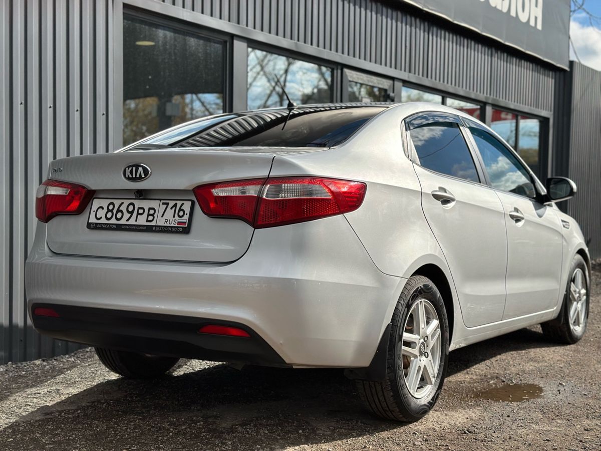 Kia Rio III 6-speed 1.6 MT (123 л.с.) Luxe 2014 — фото 7