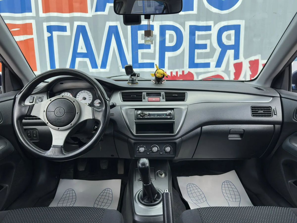 Mitsubishi Lancer — фото 8